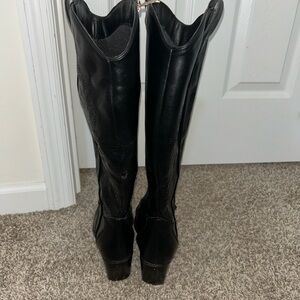 Woman’s knee high cowgirl boots